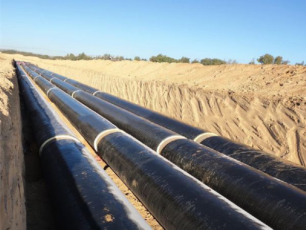 Spray wrapped buried insulation pipe